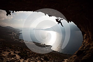 Silhouette of a rock climber at sunset