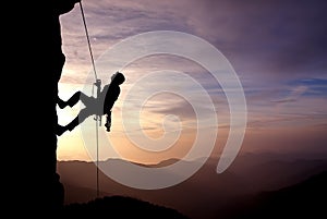 Silhouette of Rock Climber at Sunset