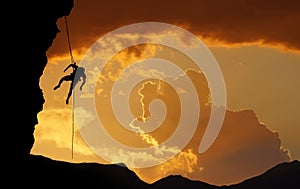 Silhouette of Rock Climber at Sunset