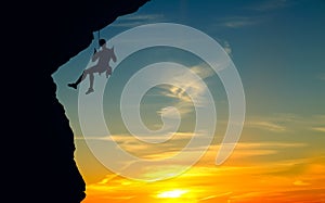 Silhouette of Rock Climber at Sunset