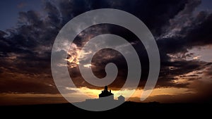 Silhouette of Romanian church with ray light after storm