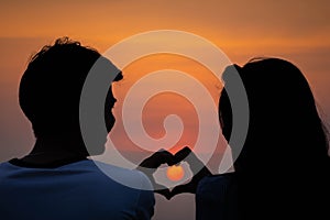 Silhouette romantic couple lover enjoying on sunset