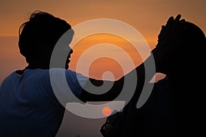 Silhouette romantic couple lover enjoying on sunset