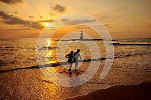 Silhouette romantic scene of couples on the beach