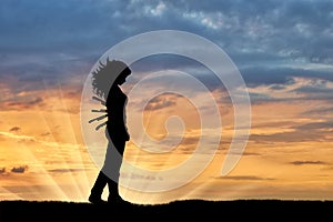 Silhouette of a sad woman with a knives in his back