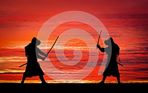 Silhouette of samurais in duel. Picture with two samurais