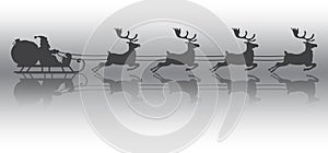 Silhouette of Santa Claus flying with the sleigh and his reindeer on Christmas background