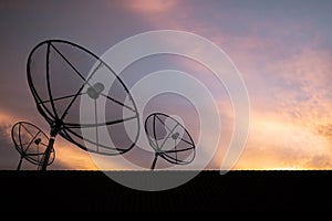 Silhouette, Satellite dish on roof with sky sunset, communication technology network image background