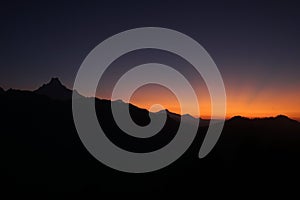 Silhouette scene and sunrise on Mt. Machapuchare, Machhapuchchhre or Machhapuchhre is a mountain in the Annapurna Himalayas