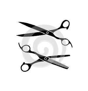 Silhouette of scissors and thinning scissors .