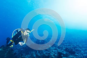 Silhouette of Scuba Diver near Sea Bottom