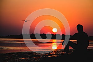 Silhouette by the sea