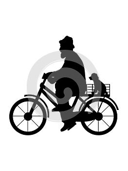 Silhouette senior man grandfather is riding bicycle with dog.