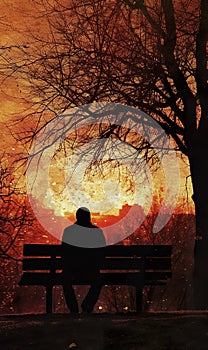 silhouette of serene lonely man sitting on park bench under tree at sunset, tranquility and calmness concept