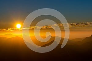 Silhouette of several mountain peaks