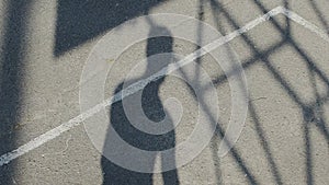 Silhouette shadow jumping man throwing the ball to hoop, basketball training