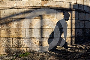 Silhouette of the shadows of people on the stone wall in Pelourinho