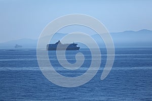 Silhouette of ship cruising on the sea