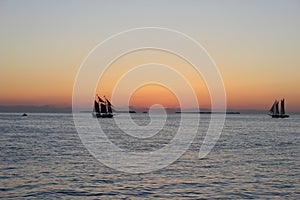 Silhouette of ships after sunset. photo