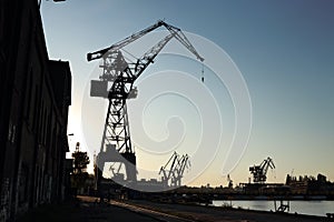 Silhouette of  shipyard`s tall crane.