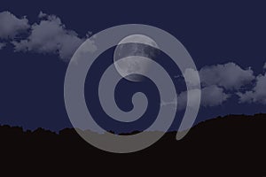 Silhouette shot of a mountain with a moon in a cloudy dark blue sky