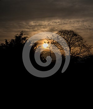 A silhouette shot of mountains and trees in the Mussoorie region of the himalayas in Northern India at sunrise