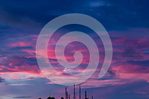 Silhouette signal antenna tower at sunset sky