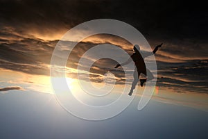 Silhouette of a skydiver