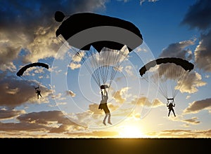 Silhouette skydiver parachutist landing