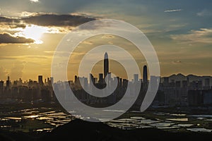 Silhouette of skyline of Shenzhen city, China under sunset. Viewed from Hong Kong border