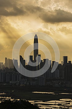 Silhouette of skyline of Shenzhen city, China under sunset. Viewed from Hong Kong border