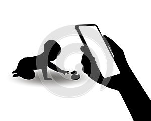 A silhouette of a smartphone in the hand of a mother of playing baby. The concept of monitoring the health of the child using new