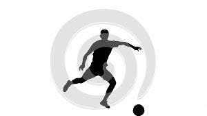 Silhouette of a soccer player isolated on a white background with alpha channel. Professional soccer player strikes the