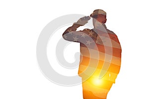 Silhouette of soldier with print of sunset and USA flag saluting isolated on white background.