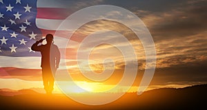 Silhouette of soldier saluting on background of USA flag. Greeting card for Veterans Day, Memorial Day.