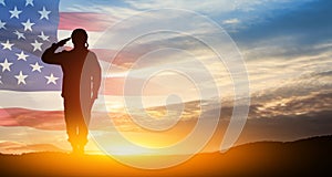 Silhouette of soldier saluting on background of USA flag. Greeting card for Veterans Day, Memorial Day.