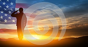 Silhouette of soldier saluting on background of USA flag. Greeting card for Veterans Day, Memorial Day.