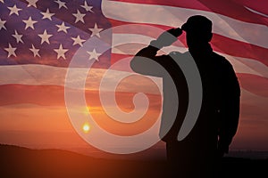 Silhouette of soldier saluting on a background of USA flag. Greeting card for Veterans Day, Memorial Day.
