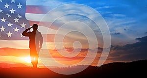 Silhouette of soldier saluting on background of USA flag. Greeting card for Veterans Day, Memorial Day.