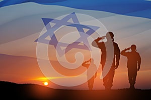 Silhouette of soldiers saluting against the sunrise in the desert and Israel flag.