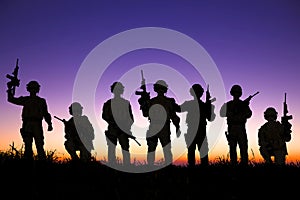 Silhouette of Soldiers team with sunrise background