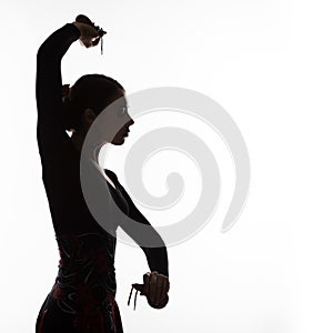 Silhouette of spanish girl flamenco dancer on a light background. free space for your text