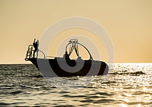 Silhouette of speed boat in the sea