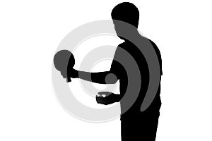 Silhouette of a sportsman getting ready to hit a ping pong ball