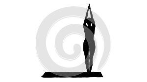 Silhouette Sporty young woman doing yoga practice.