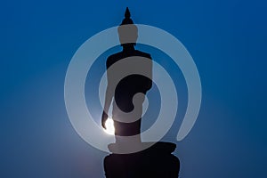 Silhouette of standing big Buddha statue during twilight time