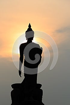 Silhouette of standing Buddha Statue at Twilight