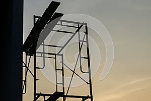 Silhouette steel scaffolding with twilight sky background at the construction site