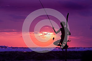 Silhouette of stilt fisherman at sunset in Koggala, Sri Lanka