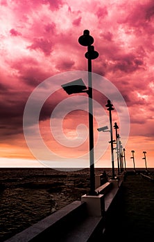 Silhouette of streetlight with sunset background